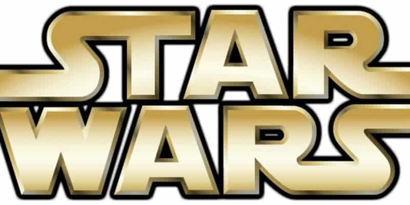 The iconic gold "Star Wars" logo with bold, block letters outlined in black stands out on a white background, instantly evoking memories of the thrilling D23 Expo 2015 at Walt Disney World, where the much-anticipated Star Wars land was first revealed to fans.