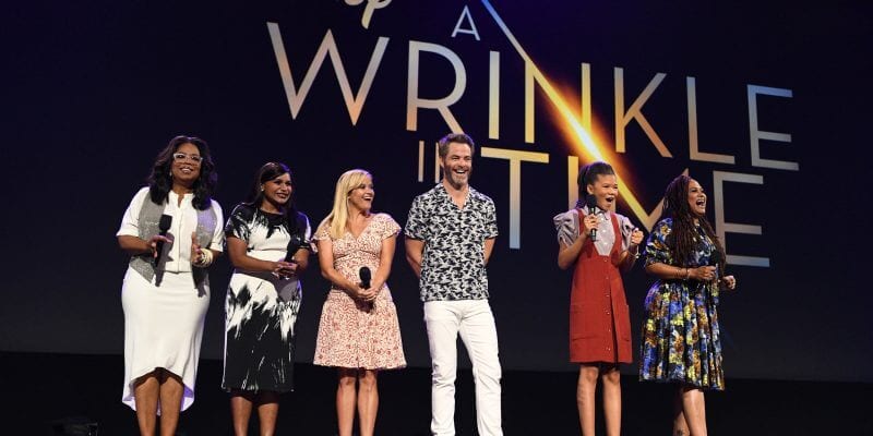 Six cast members hold microphones on stage in front of the “Disney A Wrinkle in Time” banner, capturing the excitement of a D23 EXPO 2017 presentation where Disney fans gathered for big reveals, just like when Marvel heroes appeared to introduce new Avengers: Infinity War footage.