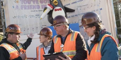A group of people wearing construction uniforms