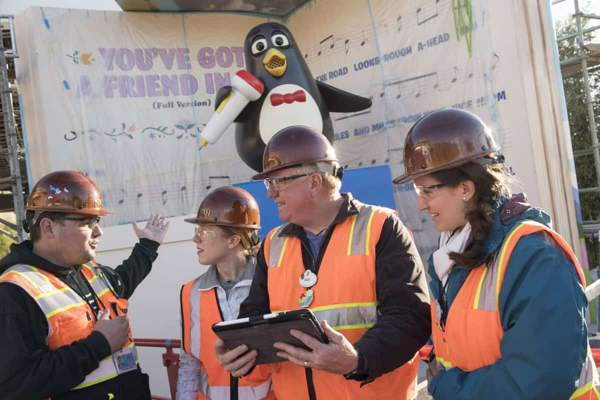 A group of people wearing construction uniforms