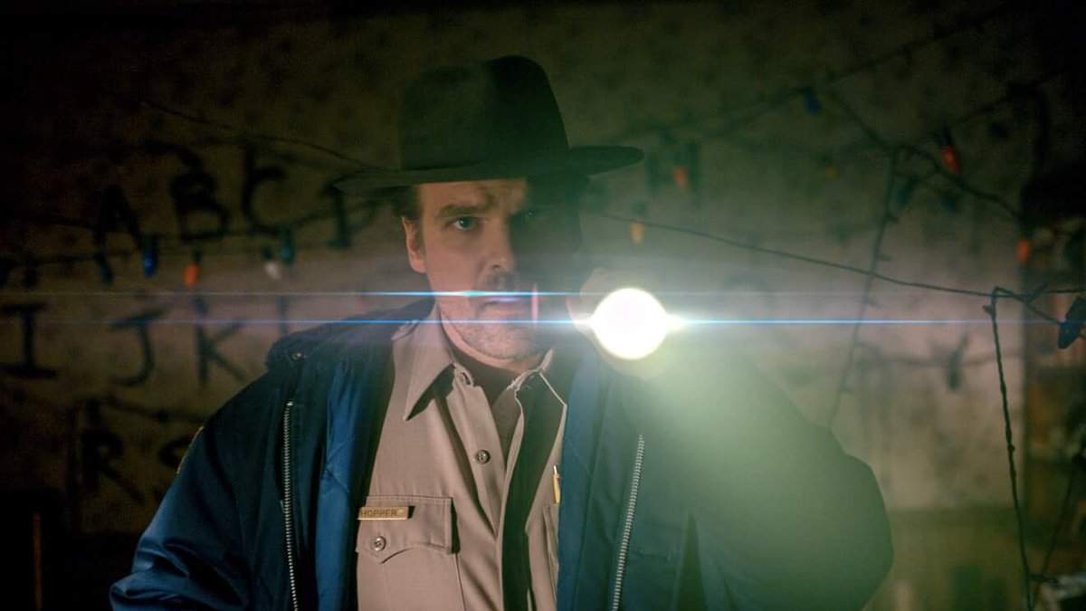 A man that is standing in the dark