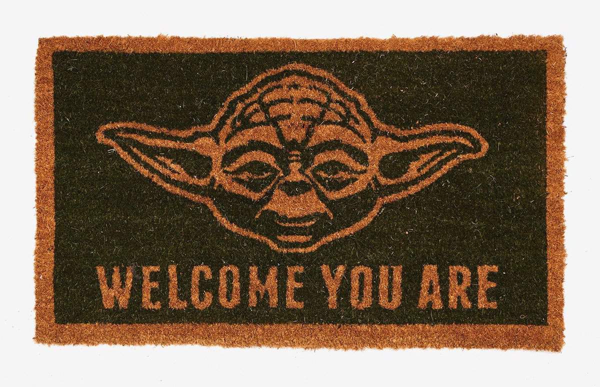 A close up of a Yoda rug