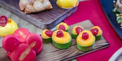 A cake with fruit on top of a wooden table
