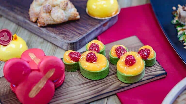 A cake with fruit on top of a wooden table