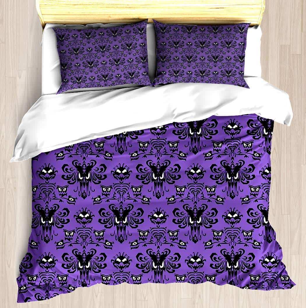 A bed with a purple blanket