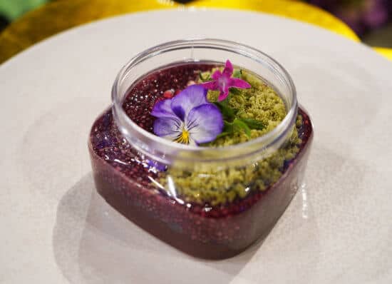 Chocolate Pudding Terrarium with Avocado Cream, Matcha Crumb, Pomegranate and Baby Herbs.