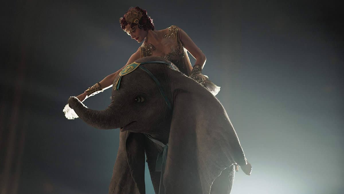 Dumbo and a woman performing on stage