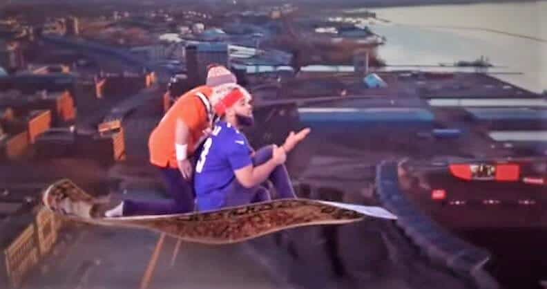 Two men with sports cloth riding on Aladdin's magic carpet
