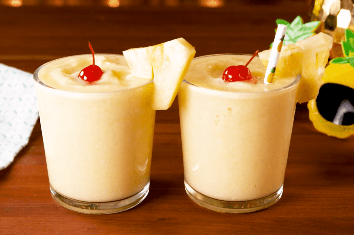Two cups of fruit shake on a table