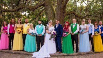 A group of people at a wedding dressed as Disney Princesses