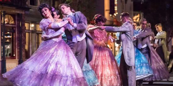 Women in dresses and men in suits dancing