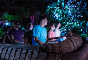 A group of people in the ride Pandora – The World of Avatar