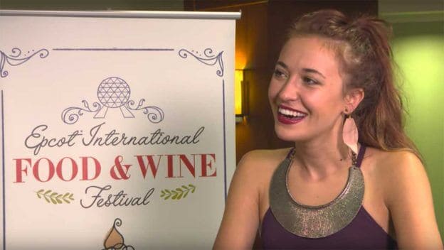 Epcot International Food and Wine Festival billboard and woman