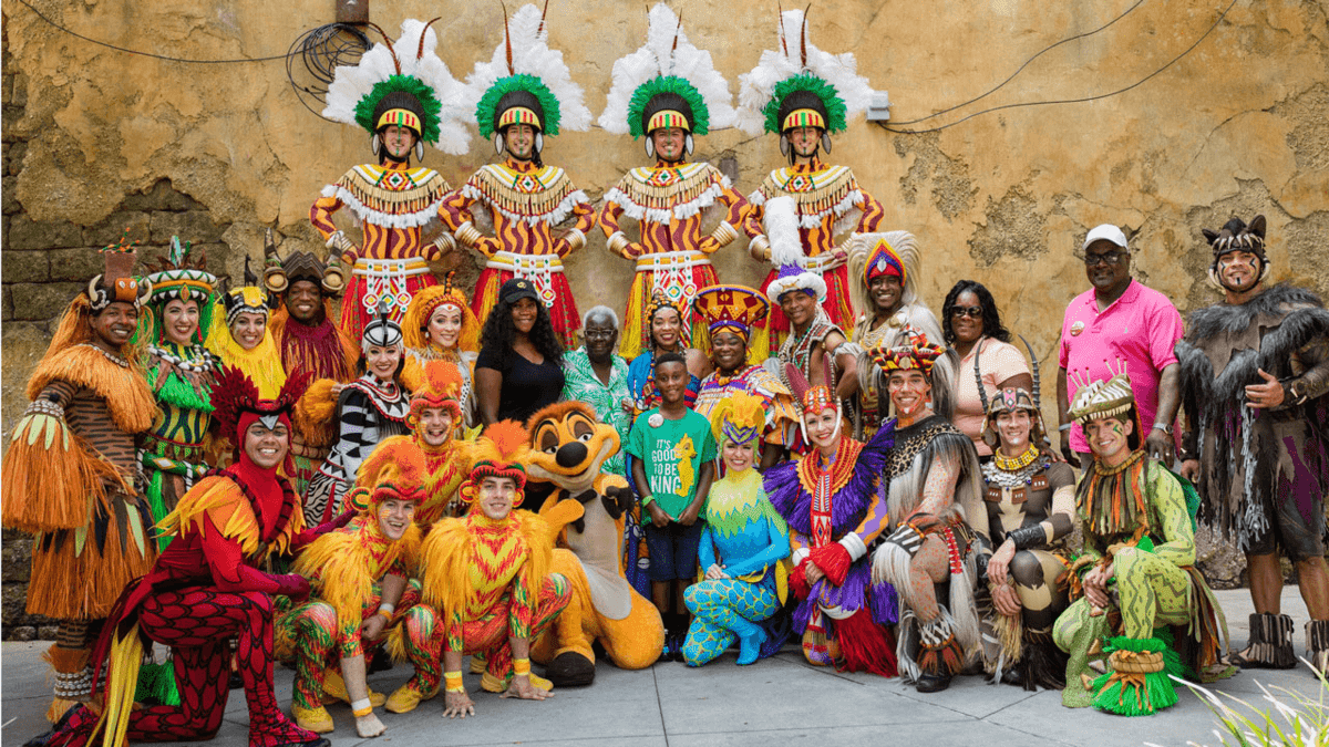 boy with cast of animal kingdom show