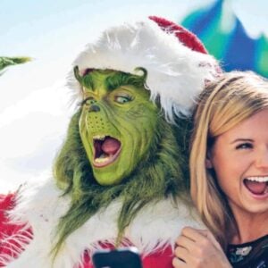 universal orlando resort guests with grinch actor during grinchmas celebration