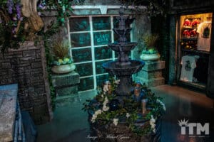 Fountain with candles and flowers in it at the merchandise store