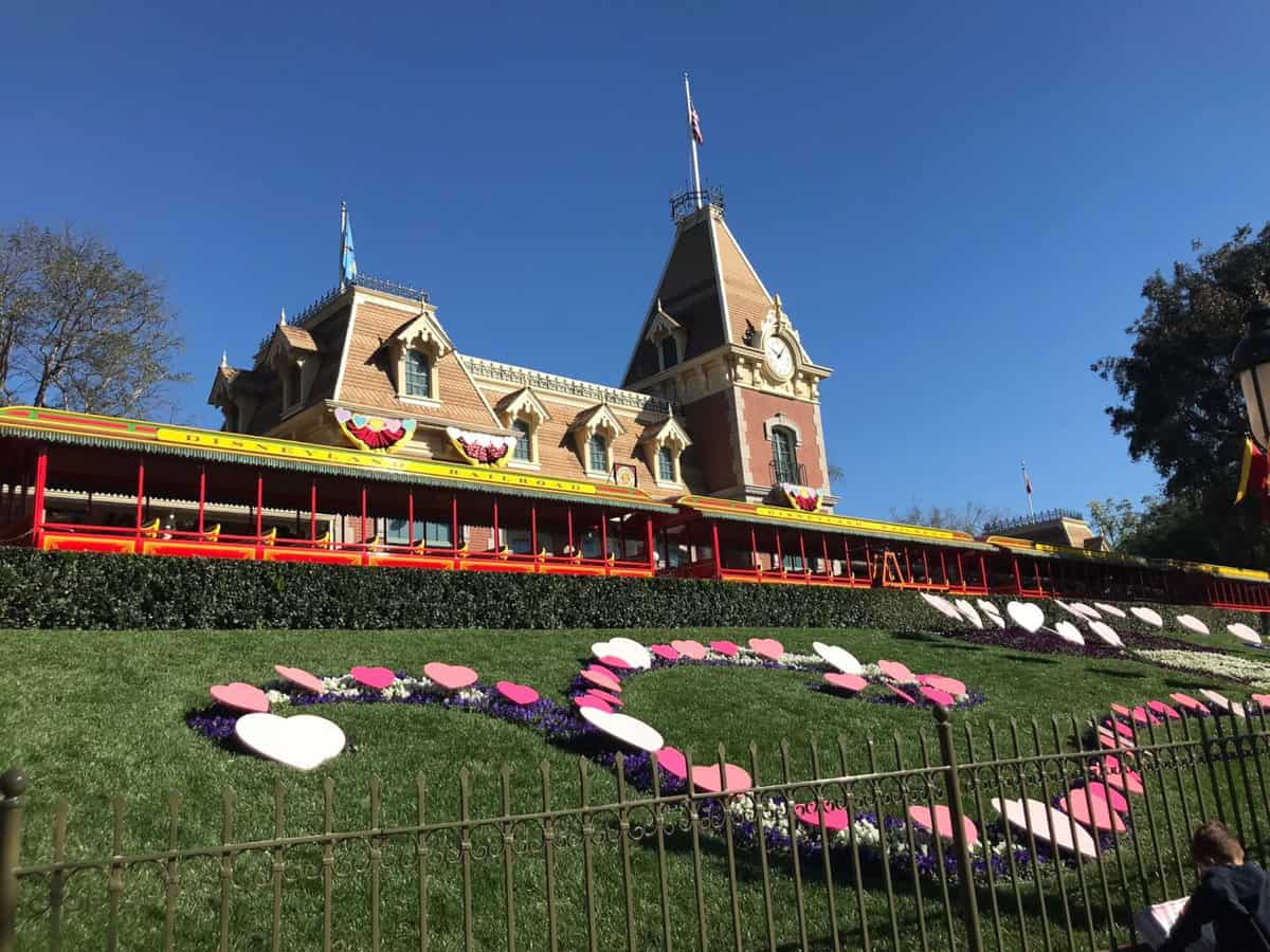 Disneyland entrance with pink topiaries 