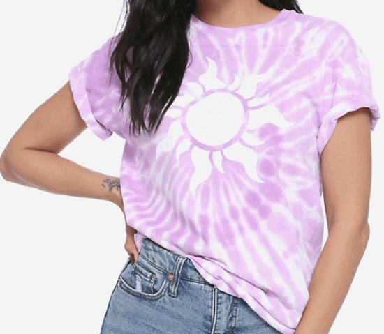 A girl wearing in a purple t-shirt and jeans