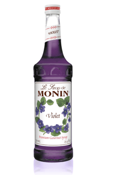 A close up of a bottle of Monin Violet Syrup