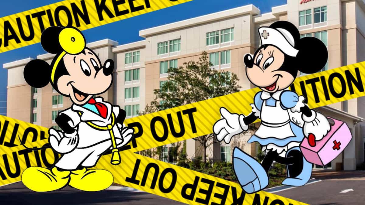 Mickey and Minnie Mouse dressed as doctors with a sign that says Caution keep out