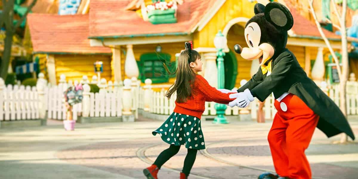 Mickey with a lucky guest in Tokyo Disneyland