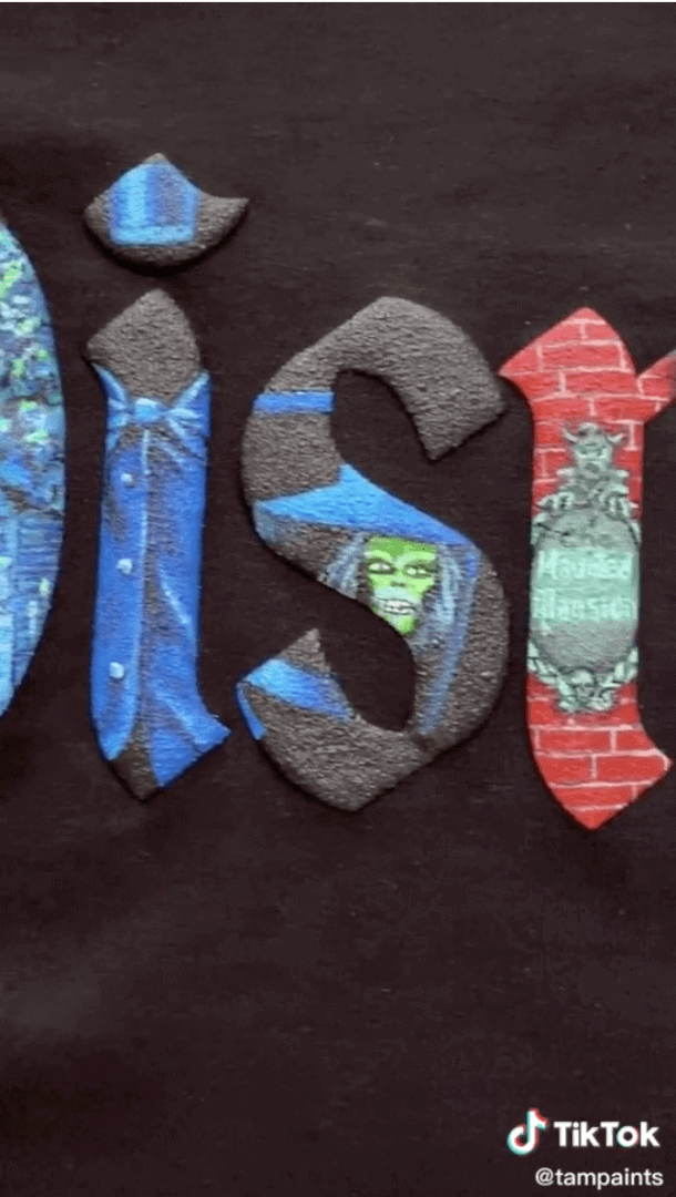 Spirit Jersey showcases Haunted Mansion-inspired spooky graphics and dimensional lettering, creating an immersive design on signature black fabric perfect for Disney Parks fans.
