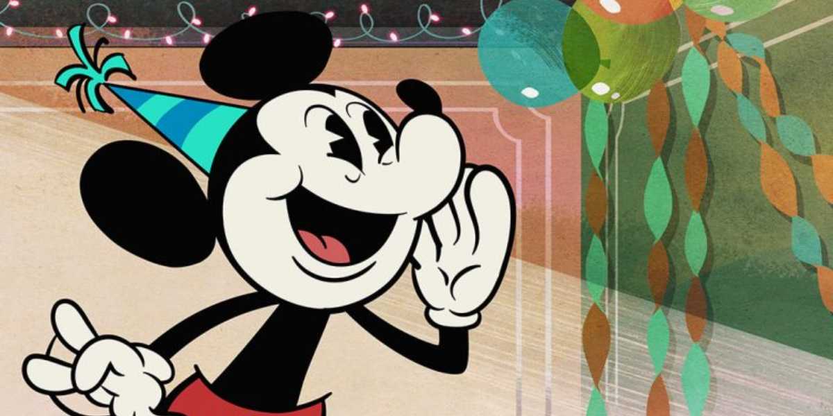 An animated character with large ears and red shorts, wearing a blue and green party hat, looks excited as they hold a hand near their mouth in a gesture of calling out. The background features colorful party balloons and streamers, reminiscent of the joy you feel when you get into Disney for free on your birthday!