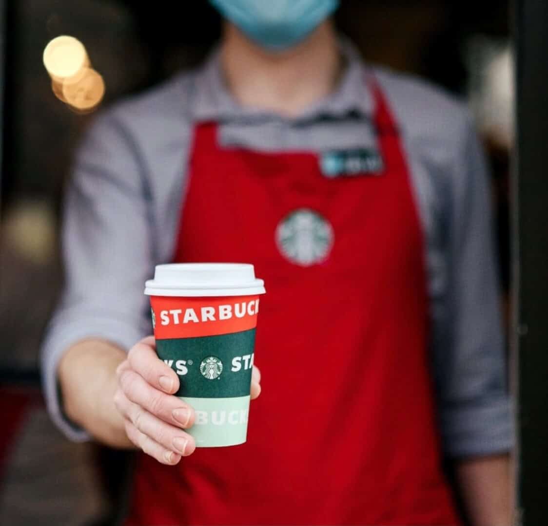 starbucks barista with red cup