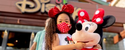 young girl wearing minnie mouse mask downtown disney