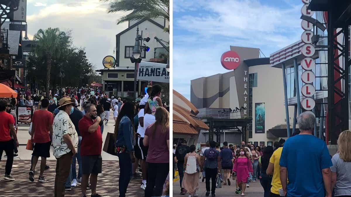 A group of people walking down the street