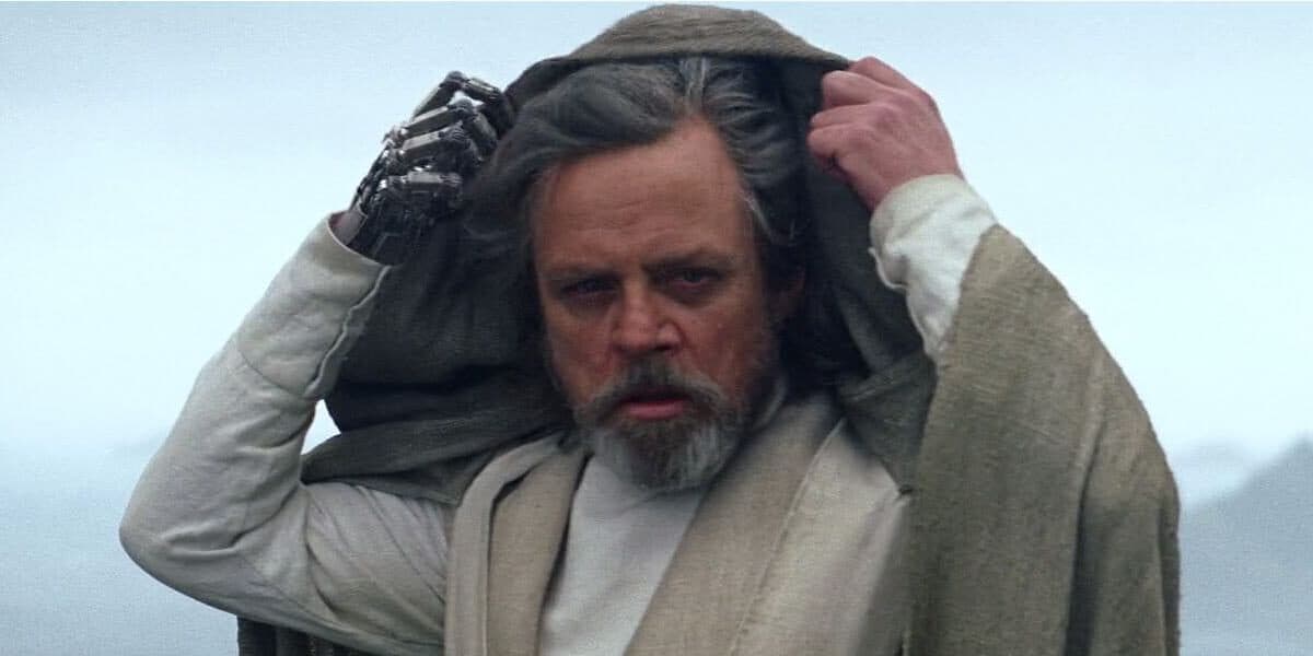 Luke Skywalker (Mark Hamill) lifting hood off his head