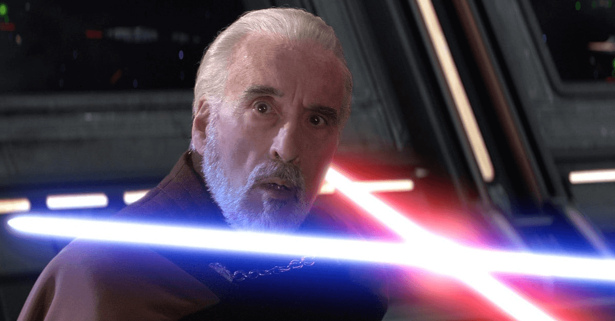A man holding a lightsaber looking at the camera