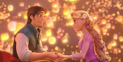 flynn (left) and rapunzel (right) in gondola surrounded by floating lanterns