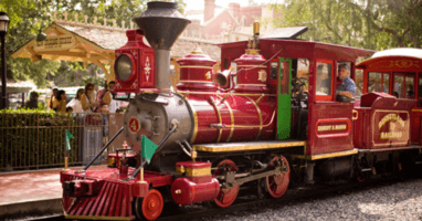 A train engine carrying carts down a track