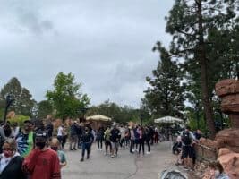 A pathway at Disneyland with only a few groups of guests.