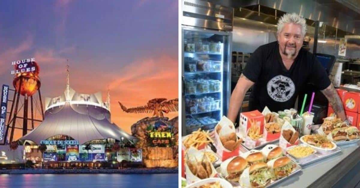 Guy Fieri standing in front of a store filled with lots of food