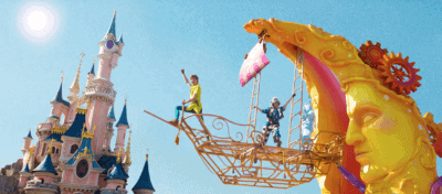 Peter Pan on a float in front of Sleeping Beauty Castle