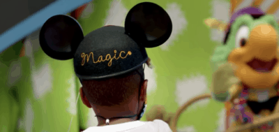 little boy wearing mickey ear hat