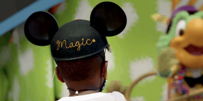 little boy wearing mickey ear hat