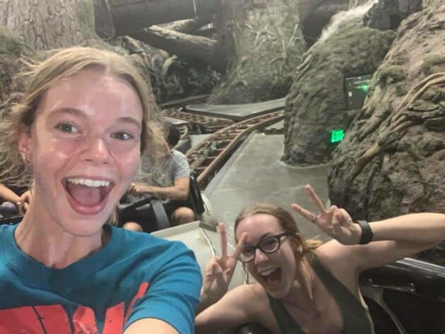 A group of people smiling and taking a selfie