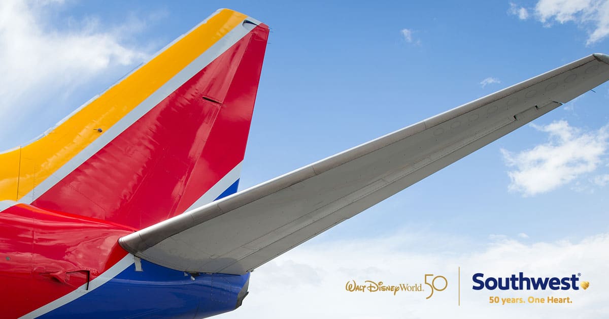 A large passenger jet flying through a blue sky