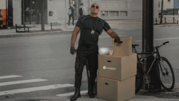 A man and a woman walking down the street