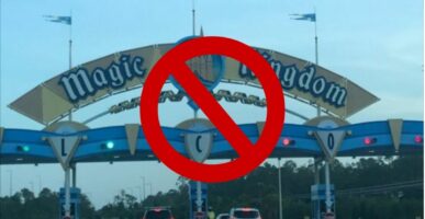 Magic Kingdom Park Sign with stop sign in front