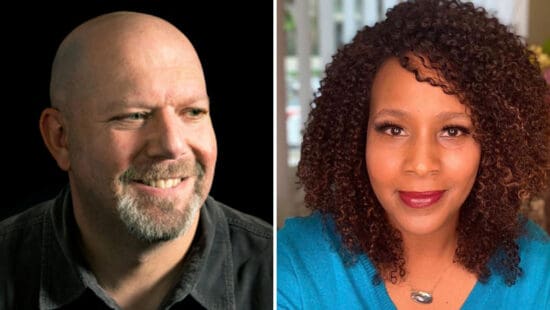 A close up of Marc Guggenheim et al. posing for the camera