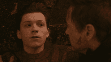 Tom Holland looking at Tony Stark before being killed by Thanos