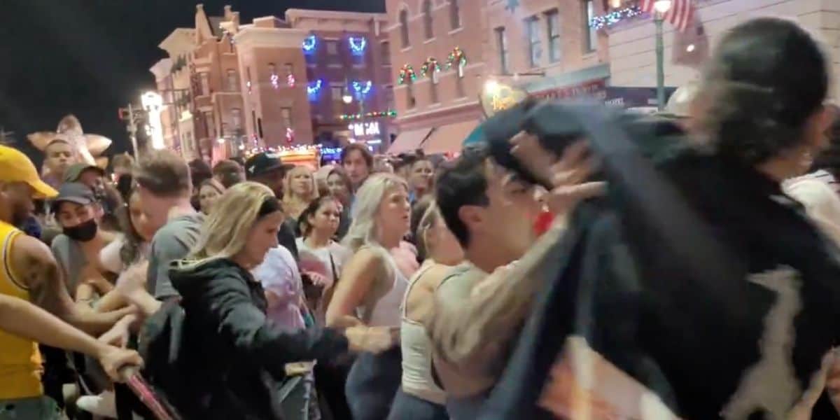 A group of people standing in front of a crowd