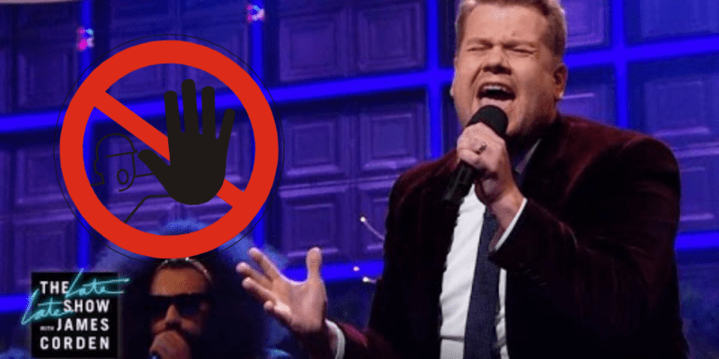 James Corden standing in front of a building