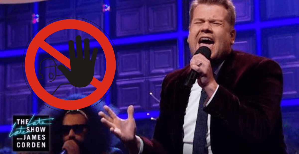 James Corden standing in front of a building