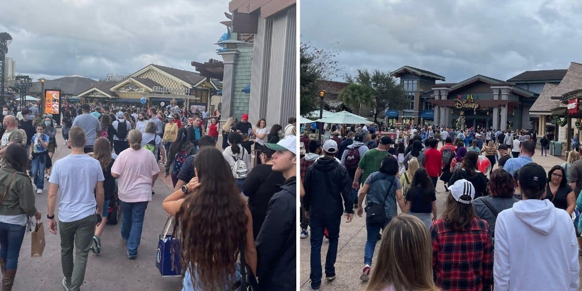 A group of people walking down the street in front of a crowd
