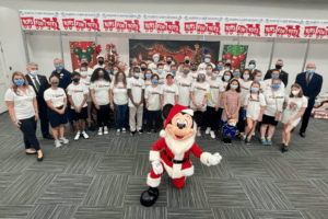 A group of people posing for the camera with Buekorps Museum in the background